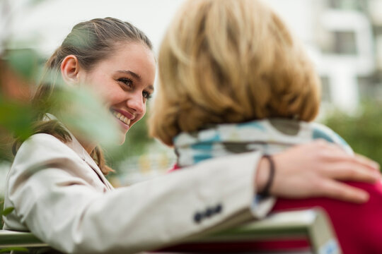 Portrait of smiling young woman spending time with her grandmother