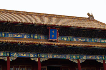 Detailed close-up of a traditional East Asian palace. The majestic architecture features an...