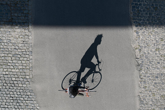 Top view of man riding bicycle