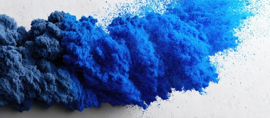 Abstract blue and dark blue pigment clouds on a light gray surface