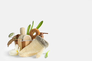 Wooden basket with spa supplies on white background
