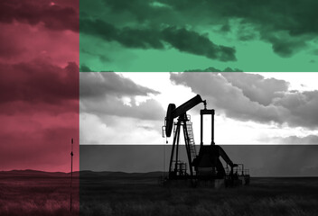 Naklejka premium Drilling for oil in the countryside with UAE national flag overlay