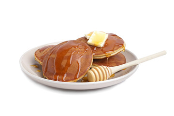 Tasty pancakes with honey and butter on white background