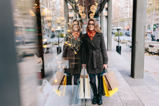 Woman doing window shopping in city