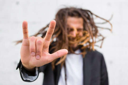 Man showing Rock And Roll Sign, close-up