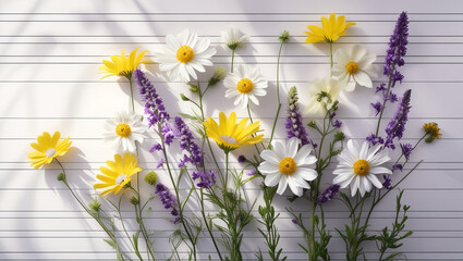 Real flowers arranged neatly like musical notes on a white textured background