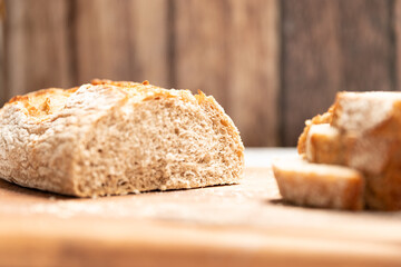 Artisan buckwheat bread slices on wooden background
