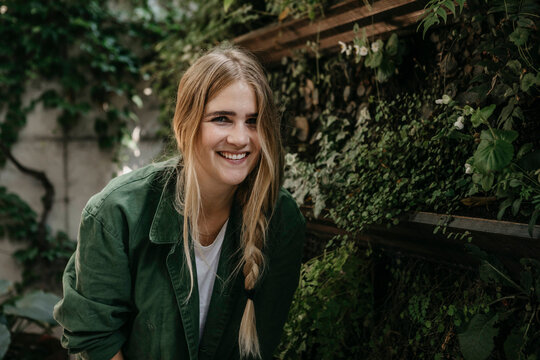 Portrait of laughing blond woman outdoors