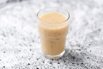 Pineapple coconut smoothie on bright background. Soft focus. Copy space.	