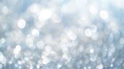 Silver bokeh background sparkles.