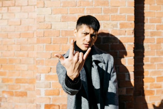 Man showing Rock And Roll Sign