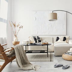 Domestic interior of living room with design modular sofa, black coffee table, lamp, armchair, decoration, art paintings and elegant personal accessories in modern home decor. Template.