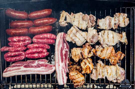 Close-up of meat cooking on barbecue grill in yard