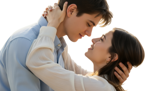 A young couple in a tender embrace gazing lovingly into each other's eyes with smiles isolate Love Romance