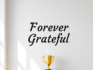Forever grateful text with a golden trophy on a white wall with sunlight