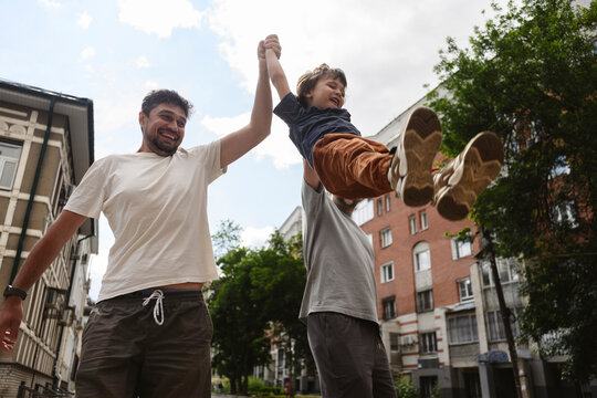 Family and friends having fun outdoors in a city street