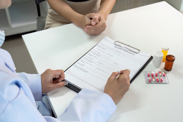 Healthcare Consultation. Doctor reviewing health summary with patient during medical appointment.