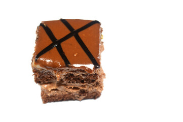 a Chocolate topped small gateau cake, Gateau bites are small bite-sized portions of cake, made of various cake flavors and fillings, miniature cakes, Eclairs, mille feuille and sponge cake