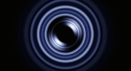 Abstract circular light trails in dark blue and white