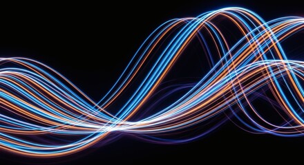 Flowing light trails of blue and orange against a black background