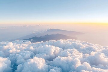 High-altitude view of clouds and mountains at sunrise