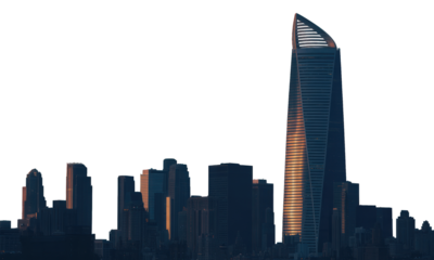 Modern cityscape with prominent, angled skyscraper at sunset