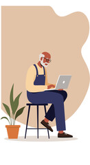 An engaged senior man with glasses and beard sits on a stool, diligently using a laptop, embodying modern digital literacy and active retirement.