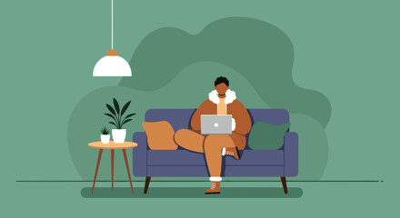 Person comfortably working on a laptop from their home couch, illustrating remote work, online learning, or a flexible modern lifestyle.