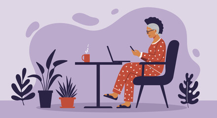 Senior woman in pajamas working from home on laptop and smartphone. Represents remote work, modern lifestyle, and digital communication for older adults.