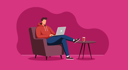 Man in a red hoodie working or relaxing on a laptop in a comfortable armchair with a drink nearby. Depicts modern lifestyle, remote work, or online learning.