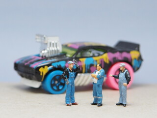 Mini toy of action figure at table with blurred background. Miniature photography concept design....