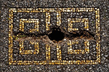 Damaged mosaic pattern on a dark ground