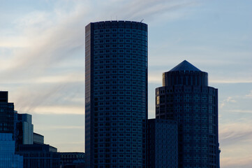 Fototapeta premium Office Towers Silhouetted at Dusk in Downtown Cityscape