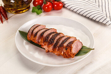 Sliced duck breast baked with cherry