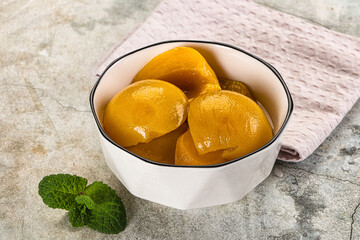 Canned marinated peach in syrop