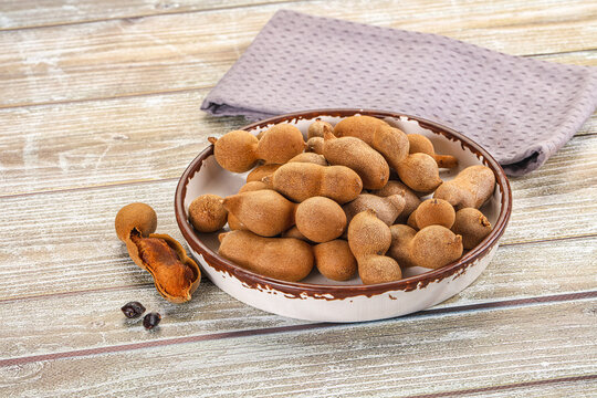 Tropical exotic Tamarind fruit heap