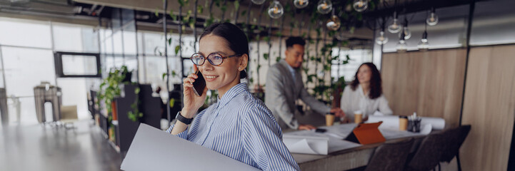 A collaborative workspace that highlights teamwork and fosters creativity within a modern office setting environment