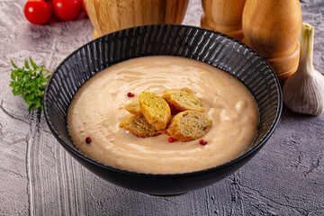 Tasty cheese cream soup with crouton