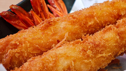  Breaded Torpedo shrimps on black plate