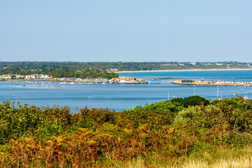 Hengistbury Head, Southbourne, UK - August 10th 2025: View from Warren Hill of the entrance to Christchurch Harbour, the gap between Mudeford Quay and Mudeford Sandbank is known as The Run.