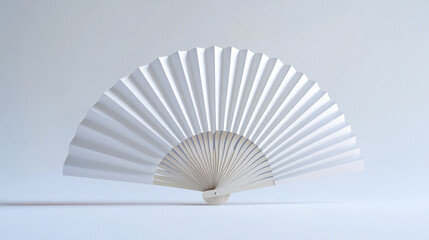 Mockup of a white folding hand fan set apart against a white background