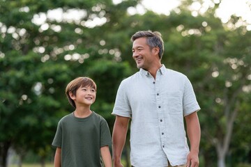 A joyful father and son enjoy a walk in a lush green park, sharing smiles and laughter. The scene captures a warm, familial bond in nature.