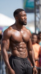 A fit man showcasing his physique at an outdoor fitness event, surrounded by an audience. The atmosphere is energetic and inspiring for fitness enthusiasts.