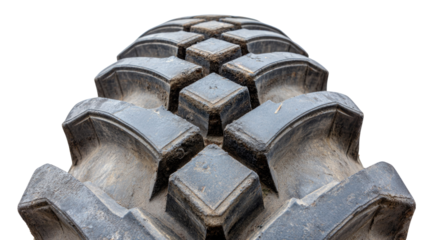 Close-Up View of Heavy-Duty Tire Tread Pattern on a Dirty Surface for Industrial and Agricultural Use