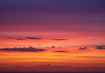 Vibrant sunset sky with streaks of orange and purple clouds