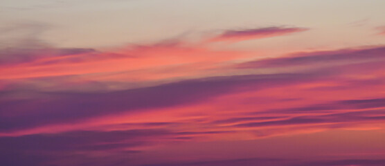 Dreamy Sunset Light Illuminating Soft Clouds in Vibrant Sky