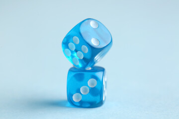 Blue game dices on color background