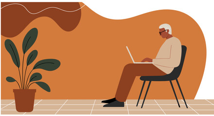 Elderly man using laptop, depicting remote work, online learning, or digital engagement for active seniors in a modern, minimalist home setting.