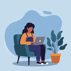 A young woman comfortably works or studies on her laptop from home. Ideal for remote work, online learning, and modern digital lifestyle concepts.