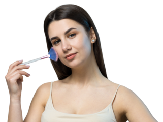Close-up of a young girl in a light top on a white background making a facial make-up. A pretty woman holds a cosmetic brush near her face and smiles.